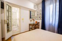 A bed or beds in a room at Vatican Rooms Irene
