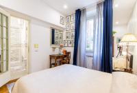 A bed or beds in a room at Vatican Rooms Irene