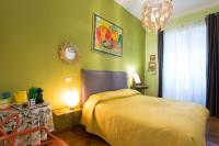 A bed or beds in a room at Vatican Rooms Irene