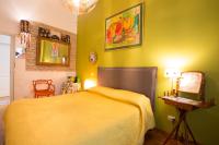 A bed or beds in a room at Vatican Rooms Irene