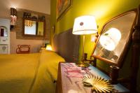 A bed or beds in a room at Vatican Rooms Irene