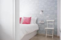 A bed or beds in a room at Las Palmas Lighthouse Apartment