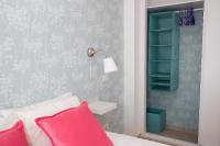 A bed or beds in a room at Las Palmas Lighthouse Apartment