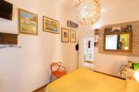 A bed or beds in a room at Vatican Rooms Irene