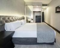 A bed or beds in a room at Ilunion Bel-Art