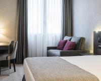 A bed or beds in a room at Ilunion Bel-Art