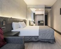 A bed or beds in a room at Ilunion Bel-Art