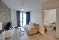 Televízia a/alebo spoločenská miestnosť v ubytovaní Funkcjonalne i Komfortowe Apartamenty Sun Seasons 24 w Kołobrzegu by Noclegi Renters