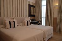 Postel nebo postele na pokoji v ubytování Gran Hotel Sardinero