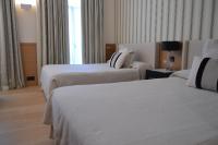 Postel nebo postele na pokoji v ubytování Gran Hotel Sardinero