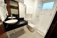 a bathroom with a sink and a toilet and a shower at Klein Ville São Leopoldo in São Leopoldo