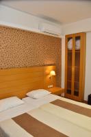 Posteľ alebo postele v izbe v ubytovaní Deves Hotel