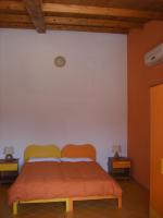 A bed or beds in a room at Agriturismo Usurtala