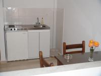 A kitchen or kitchenette at Filoxenia Hotel & Apartments