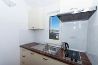 Kuchyňa alebo kuchynka v ubytovaní Apartments Fumija