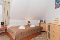 Ein Bett oder Betten in einem Zimmer der Unterkunft Willa Arielka