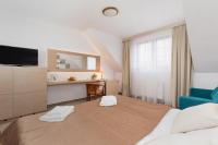 Ein Bett oder Betten in einem Zimmer der Unterkunft Willa Arielka