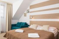 Ein Bett oder Betten in einem Zimmer der Unterkunft Willa Arielka