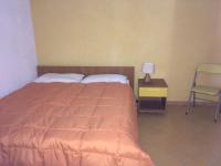 A bed or beds in a room at Agriturismo Usurtala
