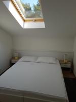 Posteľ alebo postele v izbe v ubytovaní Apartments Villa Maslinica