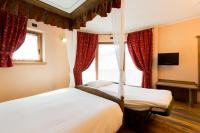 Posteľ alebo postele v izbe v ubytovaní Hotel Pontiglia