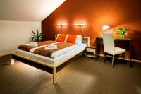 Postel nebo postele na pokoji v ubytování Hotel Bystricka
