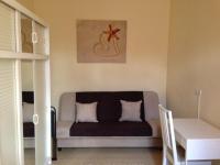 A bed or beds in a room at Péterfia Apartman