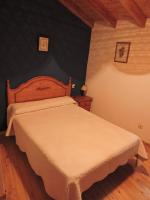 A bed or beds in a room at Ablanera 2