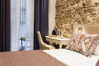 Postel nebo postele na pokoji v ubytování Hotel Palacete de Alamos