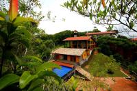 a house with a swimming pool in front of it at Highland Villa in Weligama