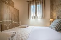 Postel nebo postele na pokoji v ubytování Ninemia Villa Zakinthos