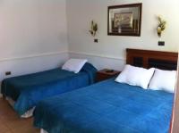 Ένα ή περισσότερα κρεβάτια σε δωμάτιο στο Hotel Altos de Atacama