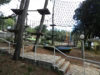 a playground with a net and a boat at Dee&#39;s House and Pool in Labin