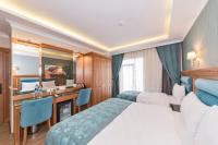 Postel nebo postele na pokoji v ubytování Magnaura House Hotel