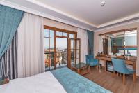Postel nebo postele na pokoji v ubytování Magnaura House Hotel