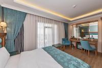 Postel nebo postele na pokoji v ubytování Magnaura House Hotel