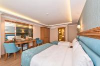 Postel nebo postele na pokoji v ubytování Magnaura House Hotel