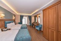 Postel nebo postele na pokoji v ubytování Magnaura House Hotel