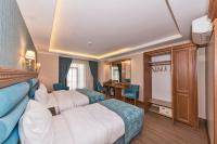 Postel nebo postele na pokoji v ubytování Magnaura House Hotel