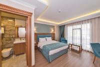 Postel nebo postele na pokoji v ubytování Magnaura House Hotel