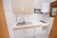 Kuchyň nebo kuchyňský kout v ubytování Apartments San Jozef