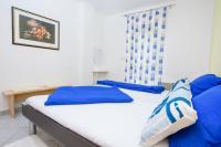 Postel nebo postele na pokoji v ubytování Apartments San Jozef
