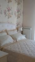 A bed or beds in a room at Daphnae House