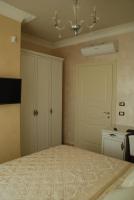 A bed or beds in a room at Daphnae House