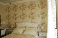 A bed or beds in a room at Daphnae House