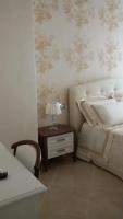 A bed or beds in a room at Daphnae House