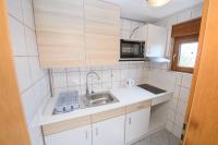 Kuchyň nebo kuchyňský kout v ubytování Apartments San Jozef