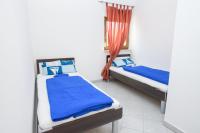 Postel nebo postele na pokoji v ubytování Apartments San Jozef