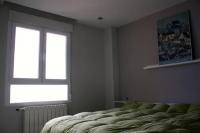 A bed or beds in a room at Cabo Mar Duplex