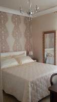 A bed or beds in a room at Daphnae House